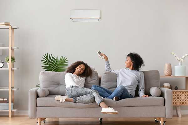 The Benefits of Staying Cool with Air Conditioning vs. Fans